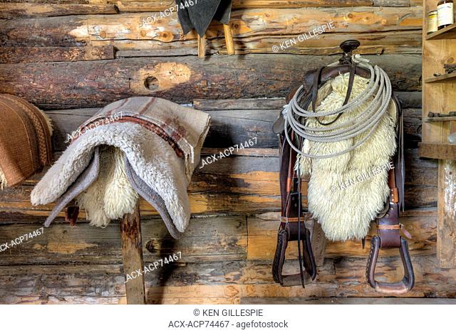 Saddle and blankets in a horse barn, Bar U Ranch National Historic Site, Alberta, Canada