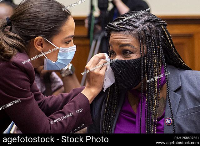 United States Representative Alexandria Ocasio-Cortez (Democrat of New York), left, wipes the teary eyes of United States Representative Cori Bush (Democrat of...