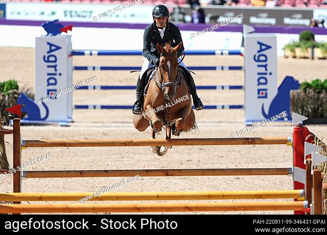 10 August 2022, Denmark, Herning: Equestrian sport: World Championship, Show Jumping. Show jumper Ismael Garcia Roque (Spain) rides La Costa