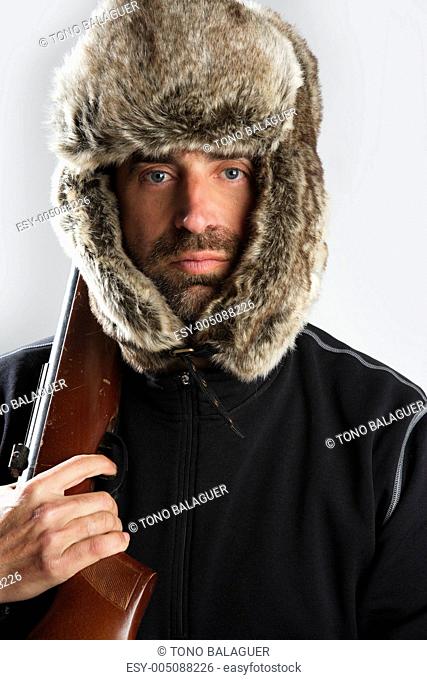 hunter winter fur hat man portrait holding gun