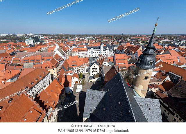 16 April 2019, Saxony, Freiberg: Panoramic view from the tower of the church St. Petri to the oldtown with the cathedral St