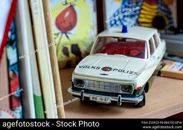 PRODUCTION - 21 September 2022, Saxony, Auerbach: A remote-controlled model Wartburg of the People's Police stands in a GDR children's room in the museum in...