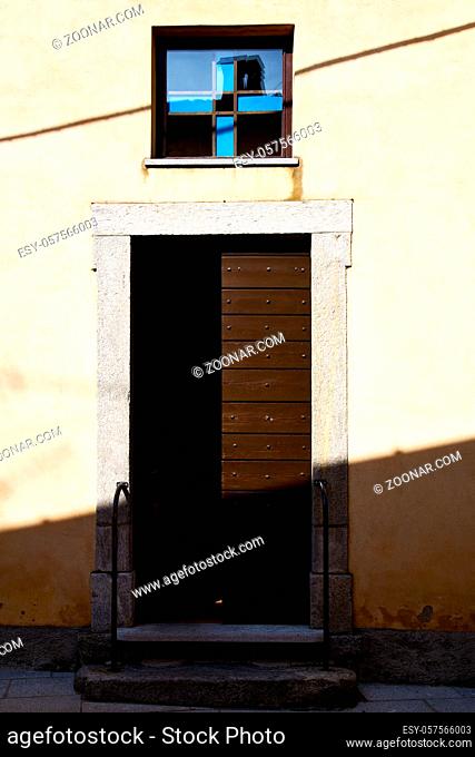 brown europe italy lombardy    in the milano old  window closed brick   abstract grate  door terrace