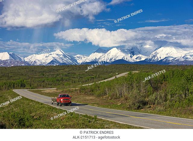 Scenic View Of A Truck Travelling On The Richardson Highway With The Alaska Range In The Background, Alaska