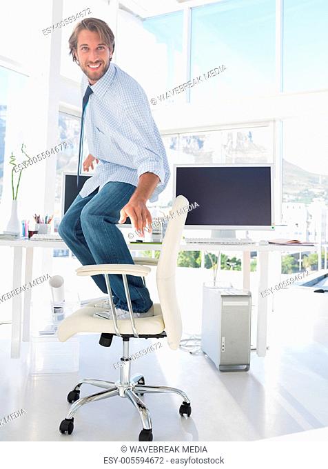 Man surfing his swivel chair
