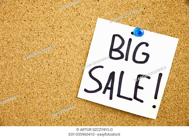 Phrase BIG SALE in black ext on a sticky note pinned to a cork notice board