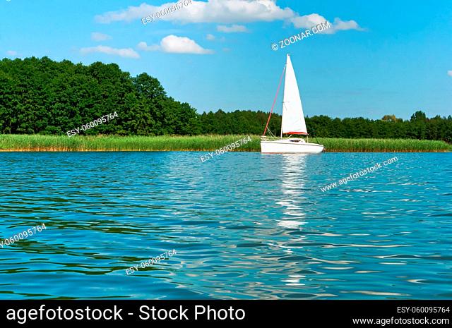 one yacht on the lake in summer, lonely white yacht, one yacht with white sails