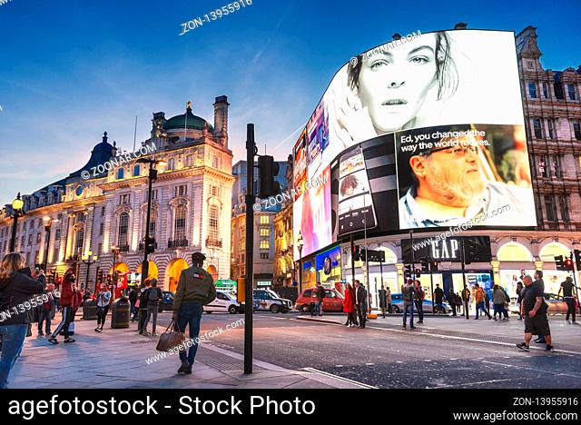 London, United Kingdom - May 13, 2019: Famous Piccadilly Circus square. Neon signage shines at night. These signs have become a major attraction of London