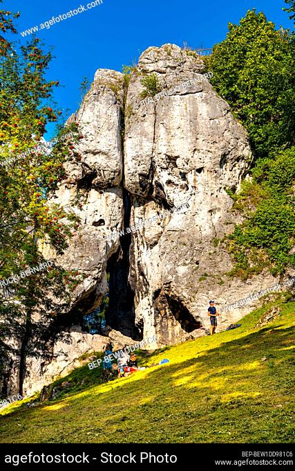 Podzamcze, Poland - August 25, 2020: Free climbers training at Jurassic limestone rock formations of Gora Birow Mountain near Ogrodzieniec Castle in Silesia in...