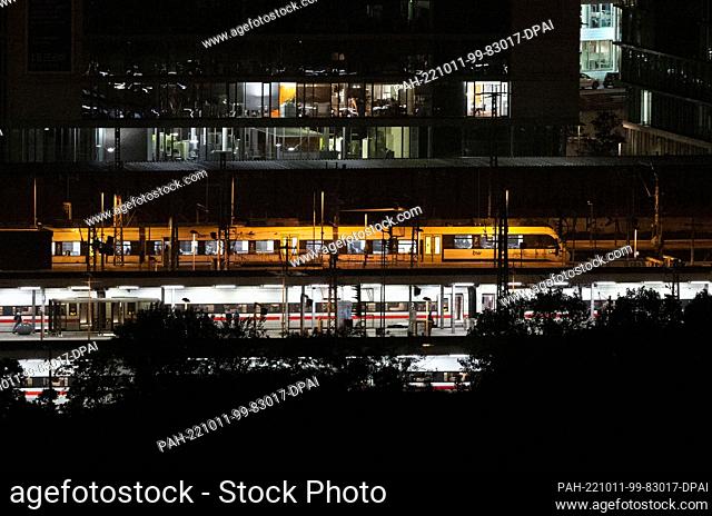 11 October 2022, Baden-Württemberg, Stuttgart: A regional train leaves the main station behind ICEs. With the opening of the new underground through station in...