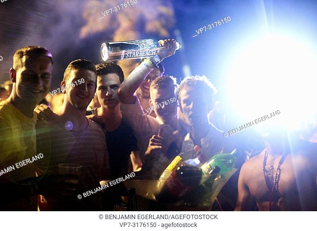 party people holding Belvedere Vodka bottle at music festival Starbeach Chersonissos, Crete, Greece, at 06. August 2018