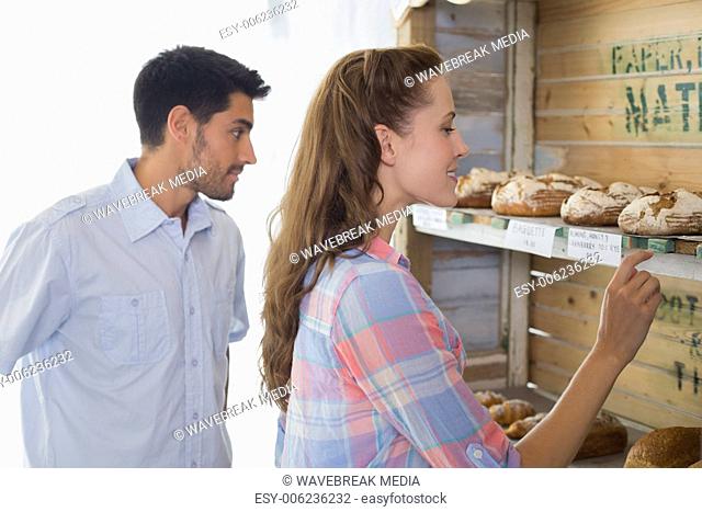 Young couple at the bakery store