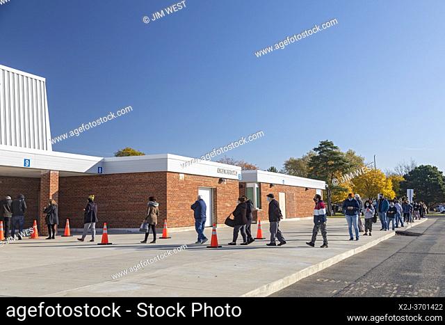 Sterling Heights, Michigan - People stand in line waiting to vote at Grissom Middle School in Macomb County during the 2020 presidential election