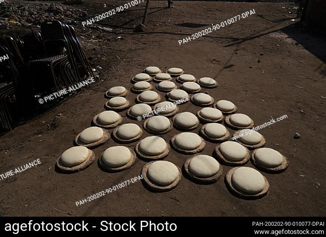 30 January 2020, Egypt, Manfalut: A picture provided on 02 February 2020 shows spheres of Sun Bread dough lying under the sun to rise before baking