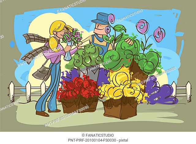 Female florist giving a bouquet of flowers to a customer