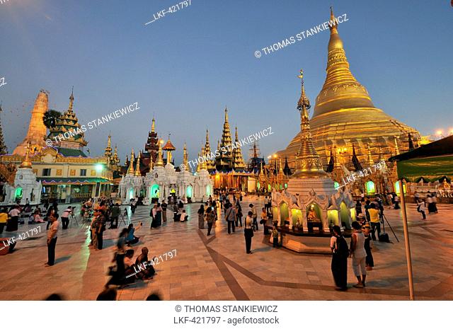 People in the evening in front of the Shwedagon Pagoda, Yangon, Myanmar, Burma, Asia