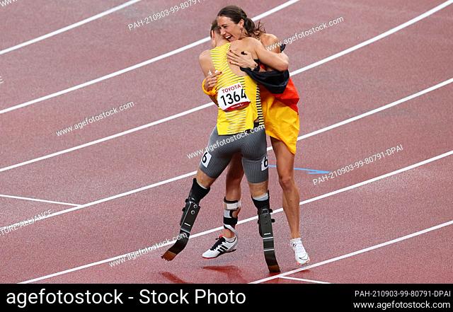 03 September 2021, Japan, Tokio: Paralympics: Athletics, men's 400 metres, T62 final, at the Olympic Stadium. Johannes Floors from Germany is happy about gold...
