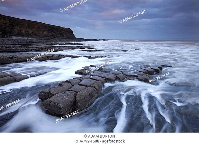 Waves rushing around broken ledges at Nash Point on the Glamorgan Heritage Coast, Wales, United Kingdom, Europe