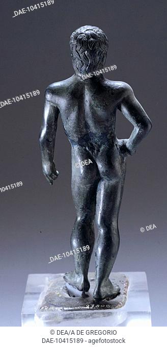 Naked figure in bronze, rear view, making an offering, from Monte Capra (Bologna). Etruscan Civilization, 420-400 BC.  Bologna