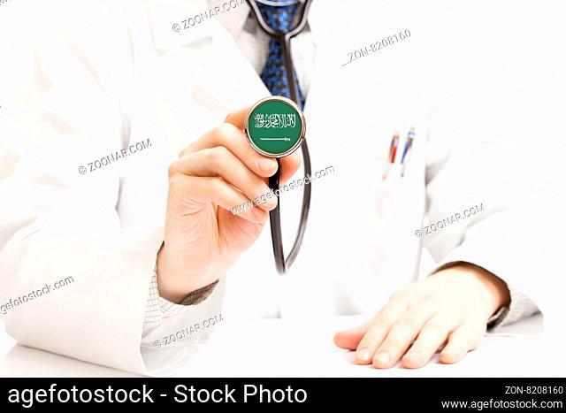 Medical doctor with stethoscope in his right hand