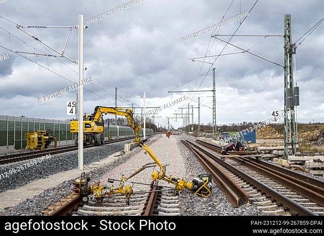 PRODUCTION - 11 December 2023, Bavaria, Eggolsheim: During track work at the station on the construction site of the ICE line between Nuremberg and Bamberg