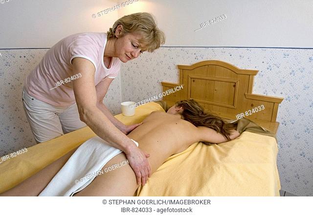 Young woman getting a massage at a spa