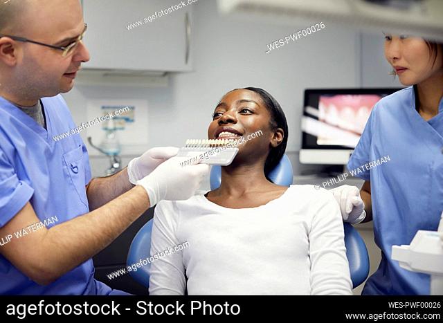 Patient getting dental teeth whitening treatment