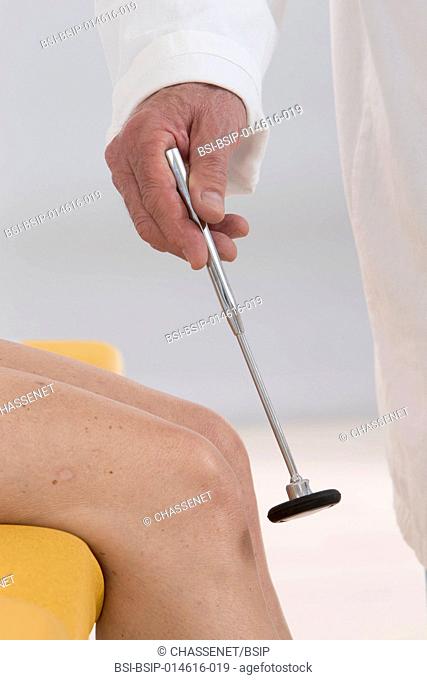 Doctor testing a patient's knee jerk reflex