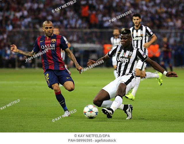 Barcelona's Dani Alves (L) and Paul.Pogba of Juventus vie for the ball during the UEFA Champions League final soccer match between Juventus FC and FC Barcelona...