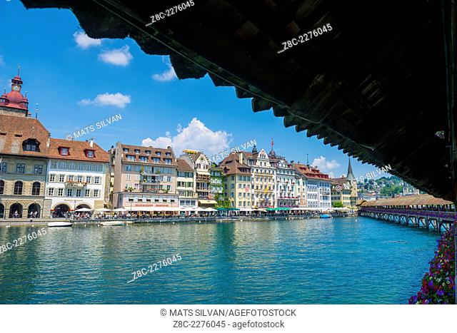 River Reuss with Chapel bridge and cityscape with blue sky and clouds in Lucerne, Switzerland