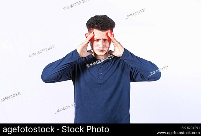 Concept of a man with a headache, man rubbing his head on isolated background, guy giving himself a head massage, concept of a man with a migraine