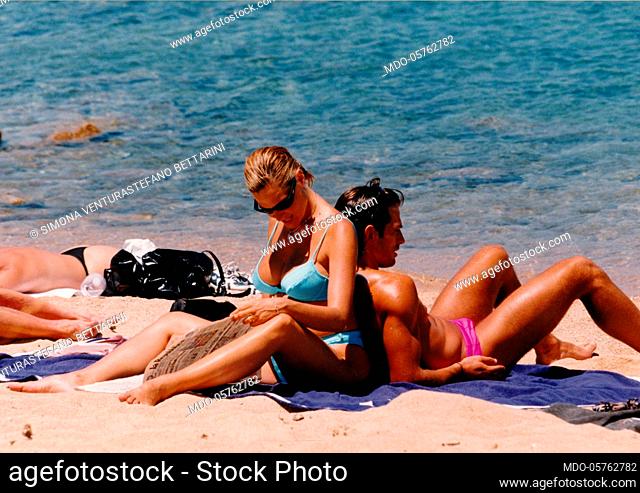 Italian television presenter and showgirl Simona Ventura, pregnant with her son Niccolò, on the beach with her husband, the Italian football player Stefano...