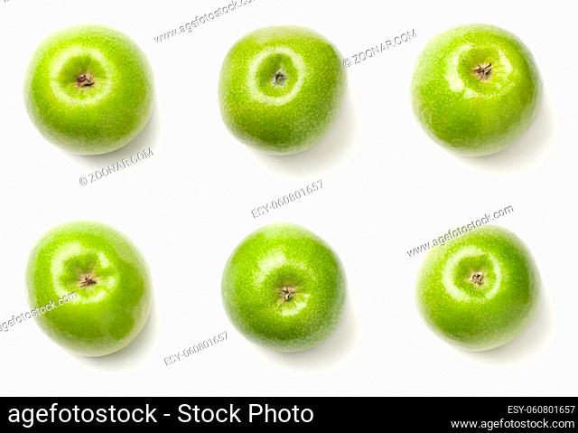 Green apples isolated on white background. The bottoms of granny smith apples. Top view