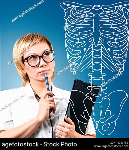 Medical doctor woman thinking near drawing human skeleton, over blue background