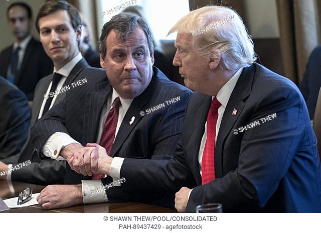 US President Donald J. Trump (R), with Senior Advisor to President Trump Jared Kushner (L), shakes hands with New Jersey Governor Chris Christie (2-R) during an...