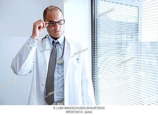Portrait of doctor with eyeglasses and stethoscope