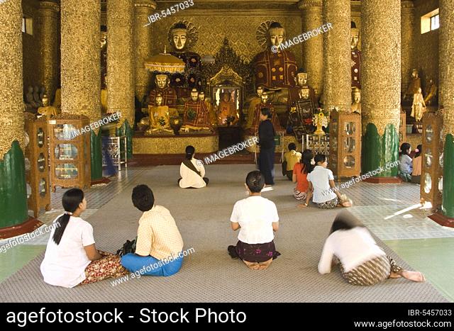 Praying worshippers, Buddha Kassapa Temple, Shwedagon Pagoda, Yangon, Burma, Myanmar, Rangoon, Asia