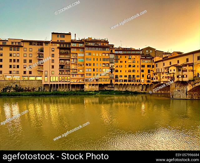 Old Bridge and Florence Lungarni at night. Panoramic cityscape of Firenze in Autumn, Tuscany - Italy
