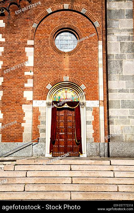 church in the   samarate closed brick tower sidewalk italy lombardy   old