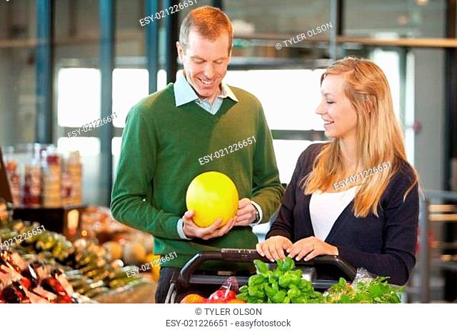 Man and Woman Buying Fruit