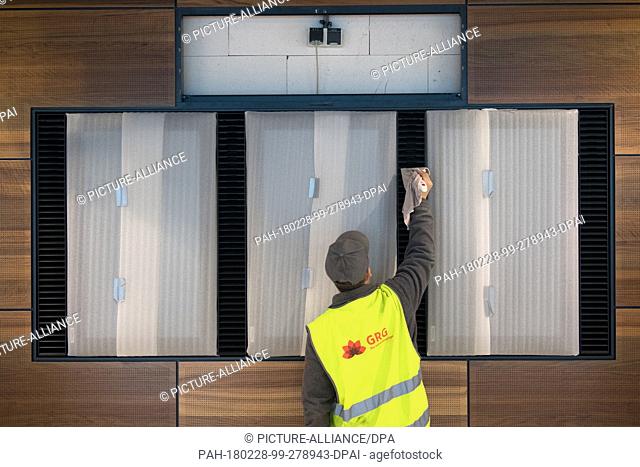 dpatop - An employee of the capital city airport cleaning in the main terminal of the Berlin-Brandenburg (BER) Airport in Schoenefeld, Germany, 28 February 2018
