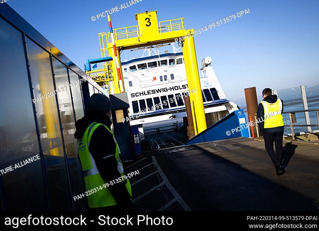 03 March 2022, Schleswig-Holstein, Dagebüll: The ferry Schleswig-Holstein of the Wyker Dampfschiffs-Reederei (WDR) is moored at the pier in the harbor of...
