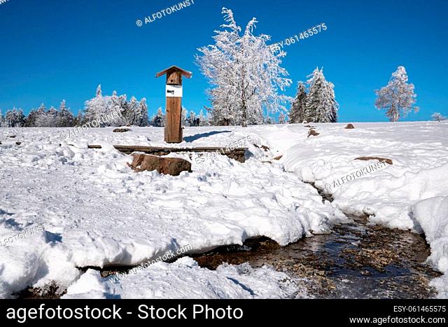 WINTERBERG, GERMANY - FEBRUARY 13, 2021: Spring of river Lenne on the top of the Kahler Asten mountain during winter on February 13, 2021 in Winterberg