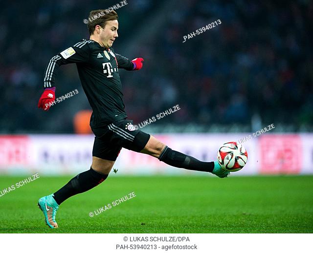 Munich's Mario Goetze plays the ball during the German Bundesliga socer match between Hertha BSC and FC Bayern Munich at Olympiastadion in Berlin, Germany