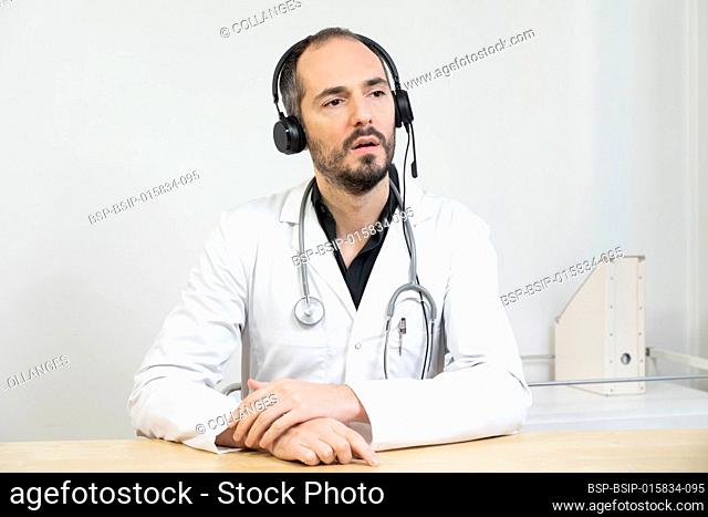 Hospital doctor during a video consultation with a patient or fellow GP