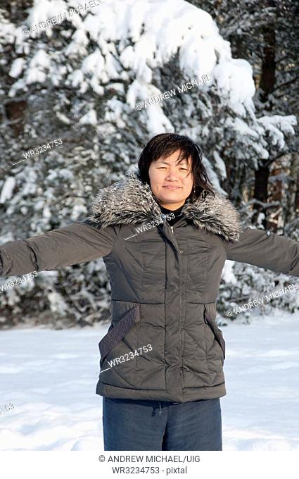A South Korean woman has fun in the snow