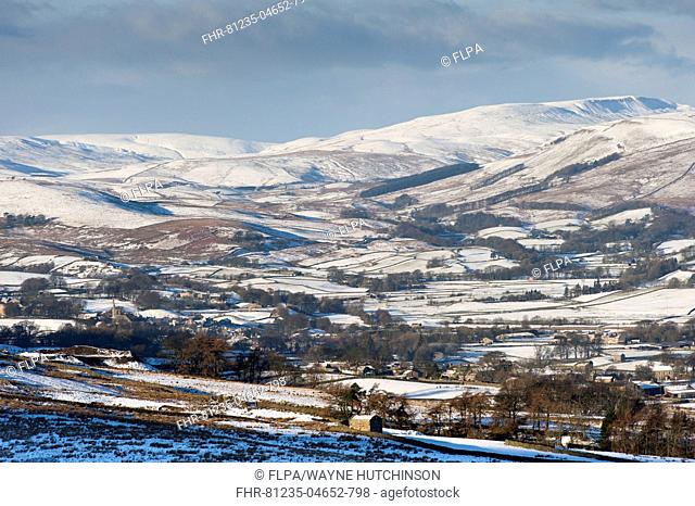 View of snow covered farmland and hills, from above Burtersett, looking towards Hawes, Upper Wensleydale, North Yorkshire, England, December