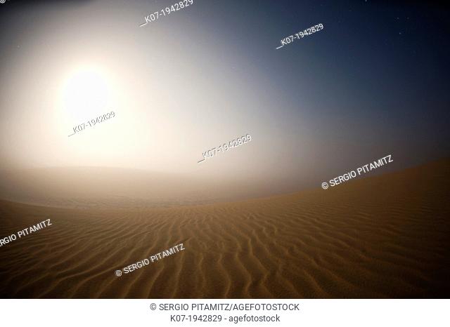Moonrise in the mist over Sand Dunes, Skeleton Coast National Park, Namibia