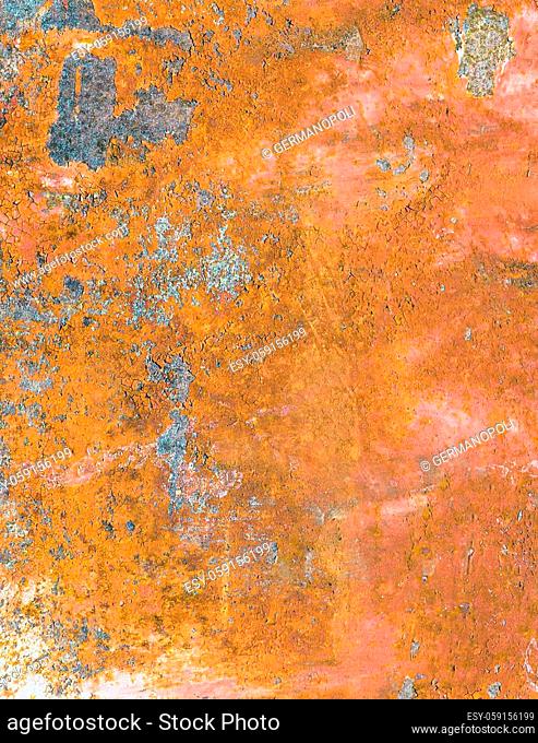 Vertical rusty metal background. Rusted metal plate with peeling paint. Severe metal corrosion. Grungy texture. Background series
