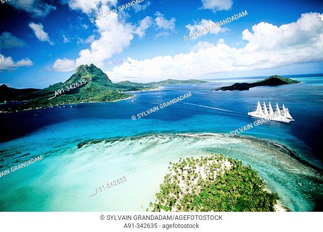 Aerial of Bora-Bora lagoon in the Leeward islands. Society archipelago. French Polynesia